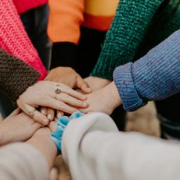 Women's hands in a circle